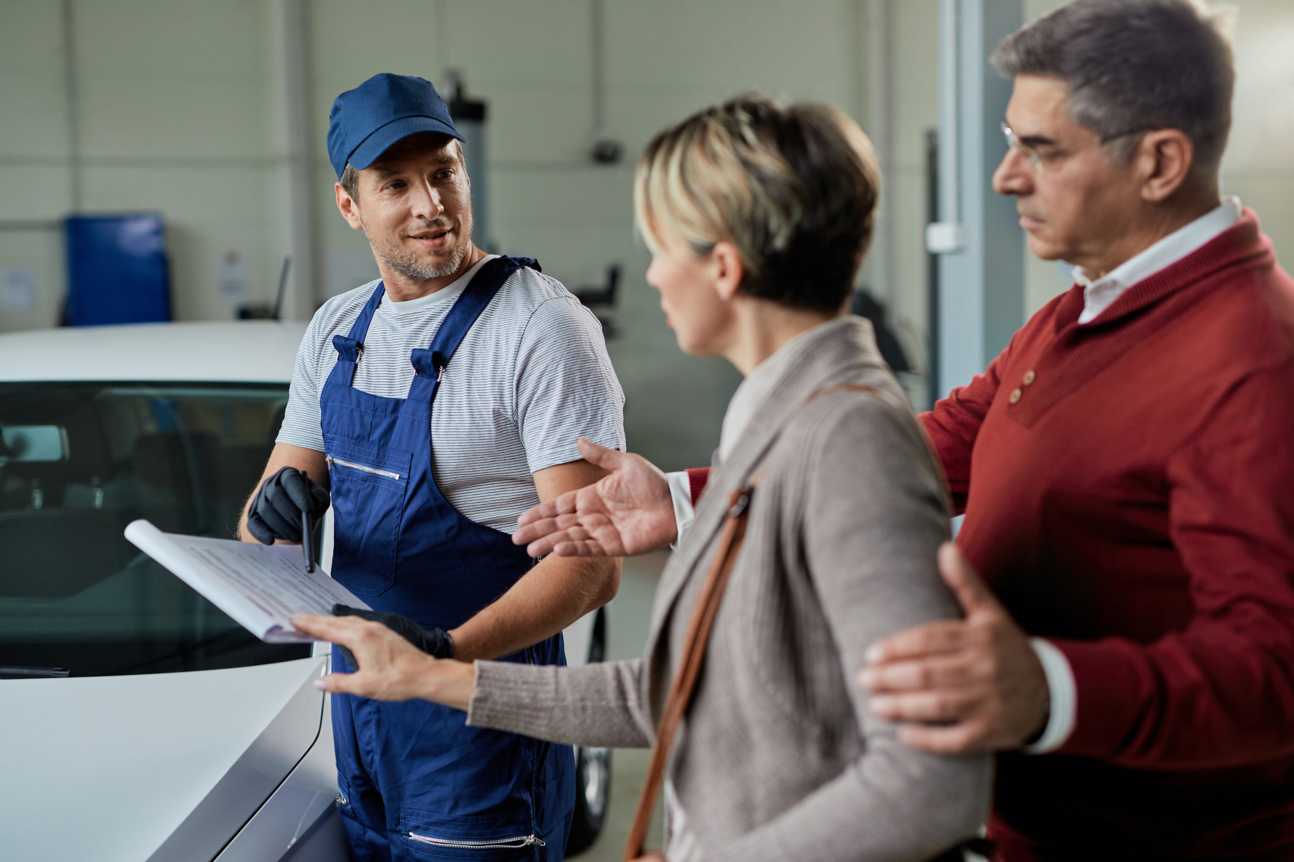 Car Mechanic with his Customers