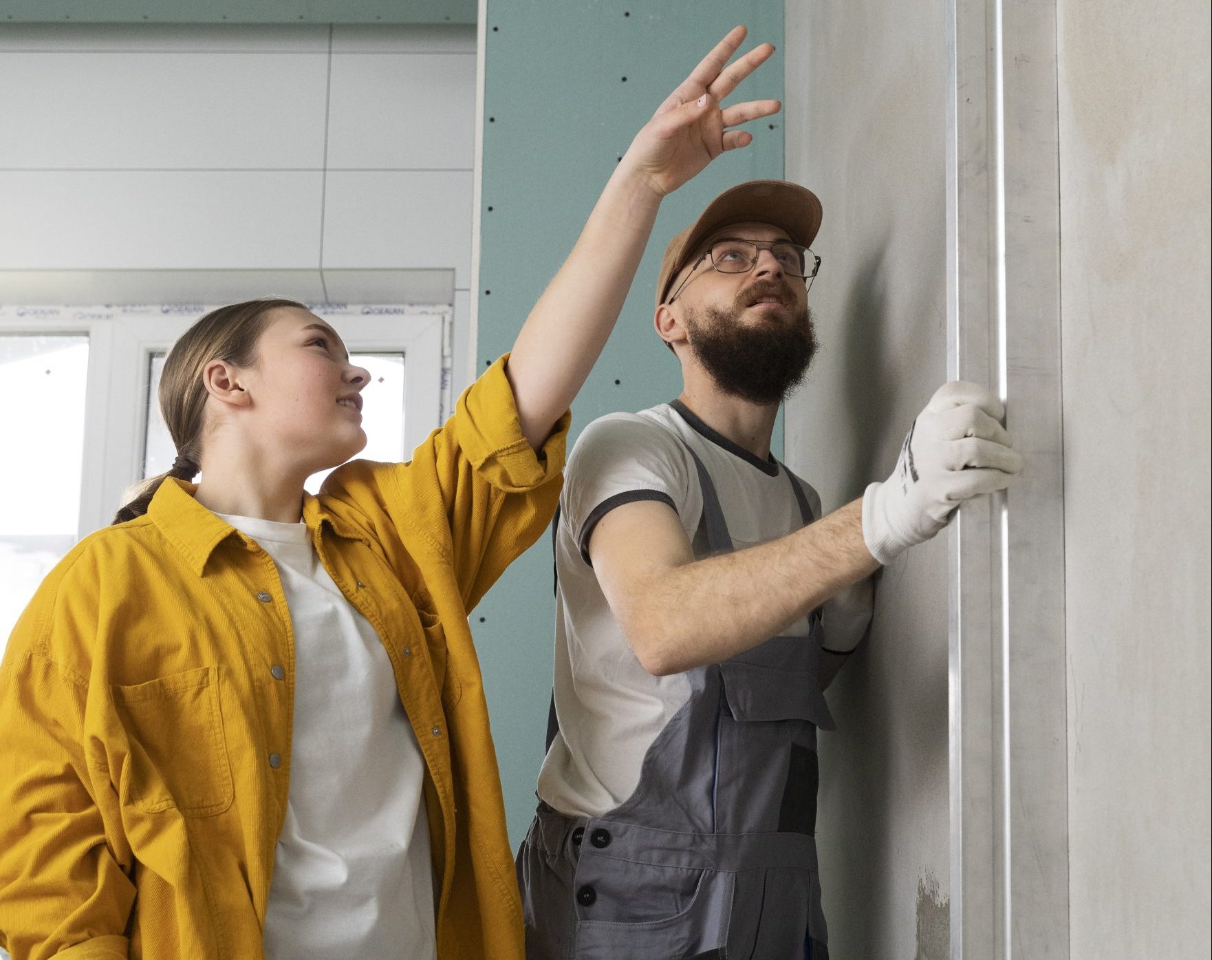 Workers checking the issue on a noisy garage door